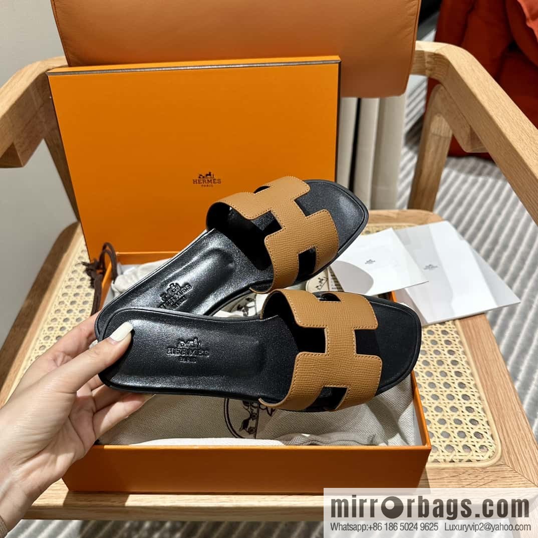 Hermès leather outsole H slippers, black and brown.