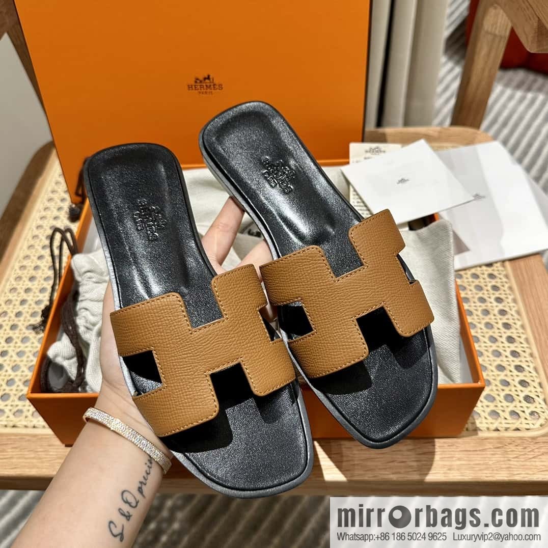 Hermès leather outsole H slippers, black and brown.