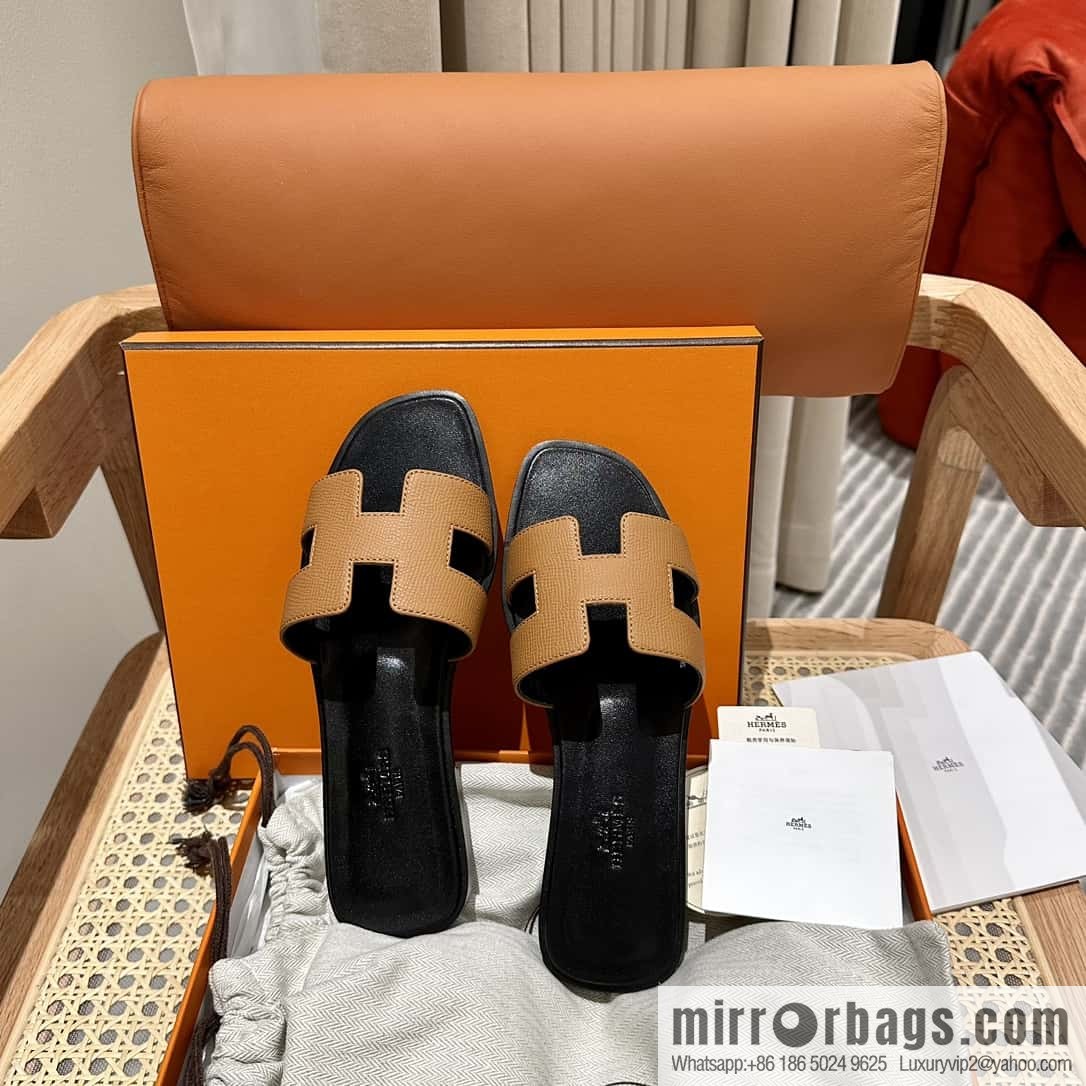 Hermès leather outsole H slippers, black and brown.