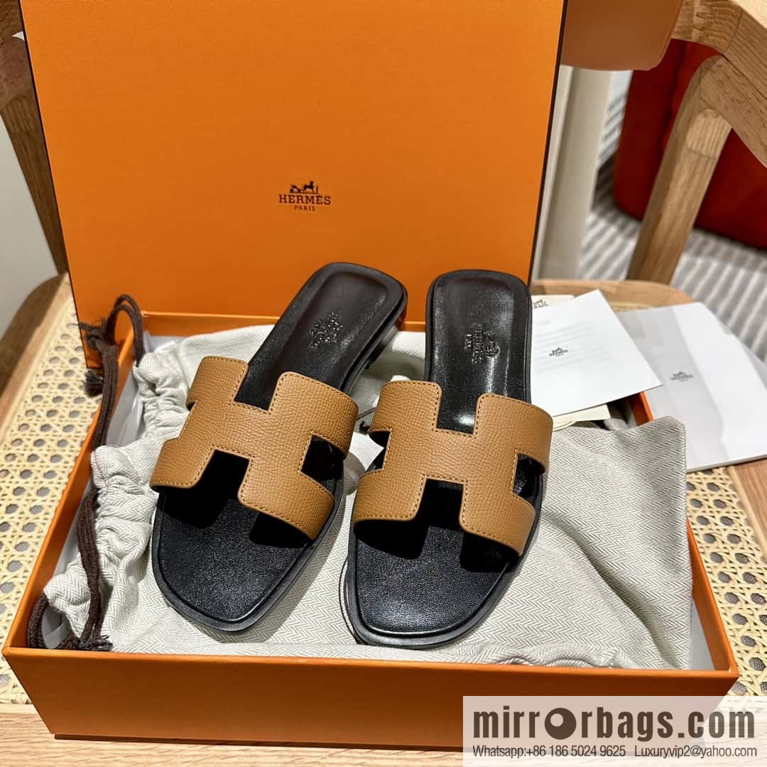 Hermès leather outsole H slippers, black and brown.