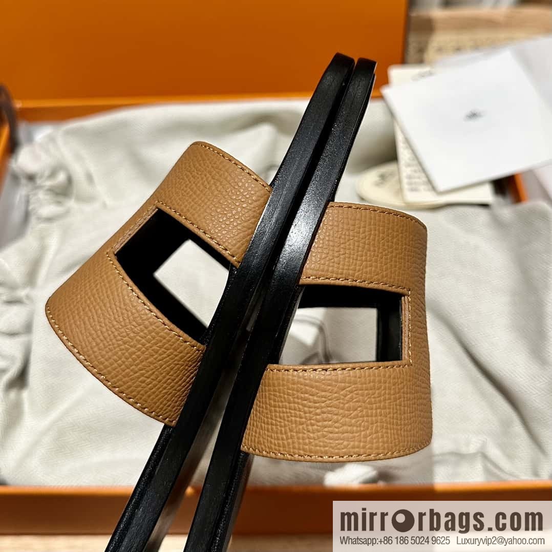 Hermès leather outsole H slippers, black and brown.