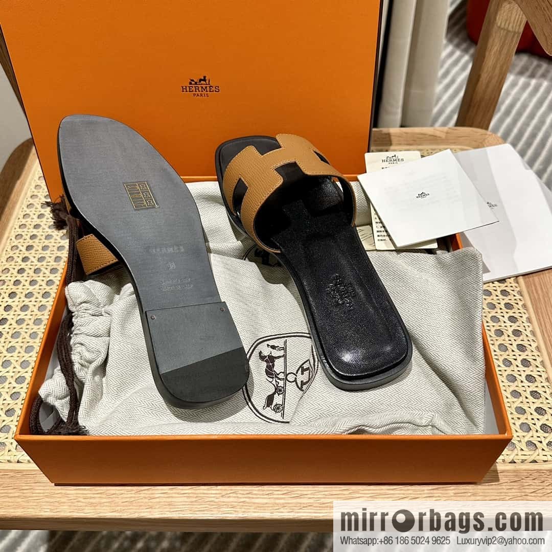 Hermès leather outsole H slippers, black and brown.