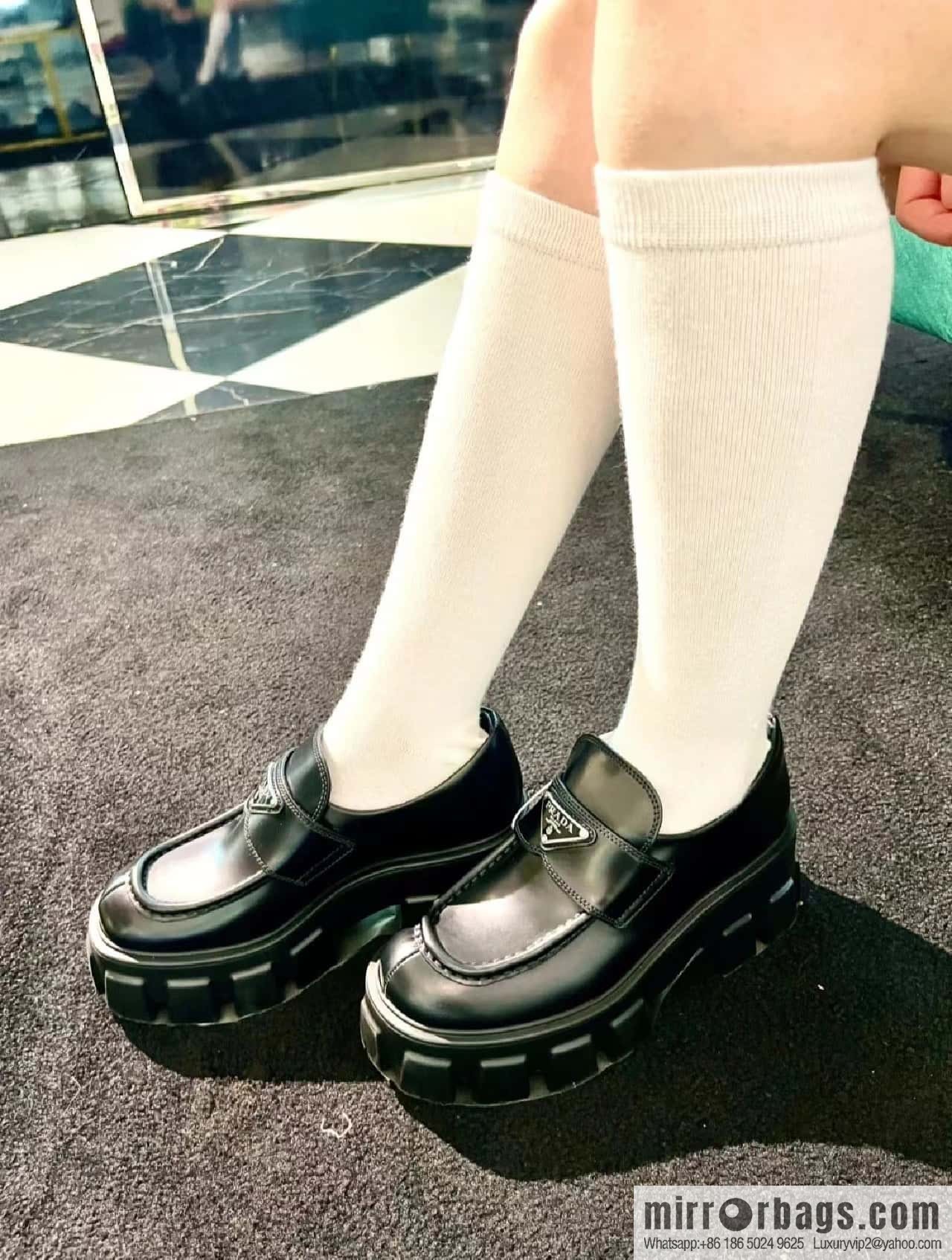 PRADA Prada, triangular label, serrated wheel muffin platform loafers 1D246M