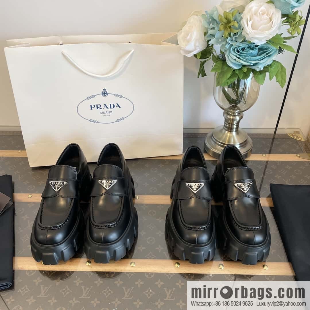 PRADA Prada, triangular label, serrated wheel muffin platform loafers 1D246M