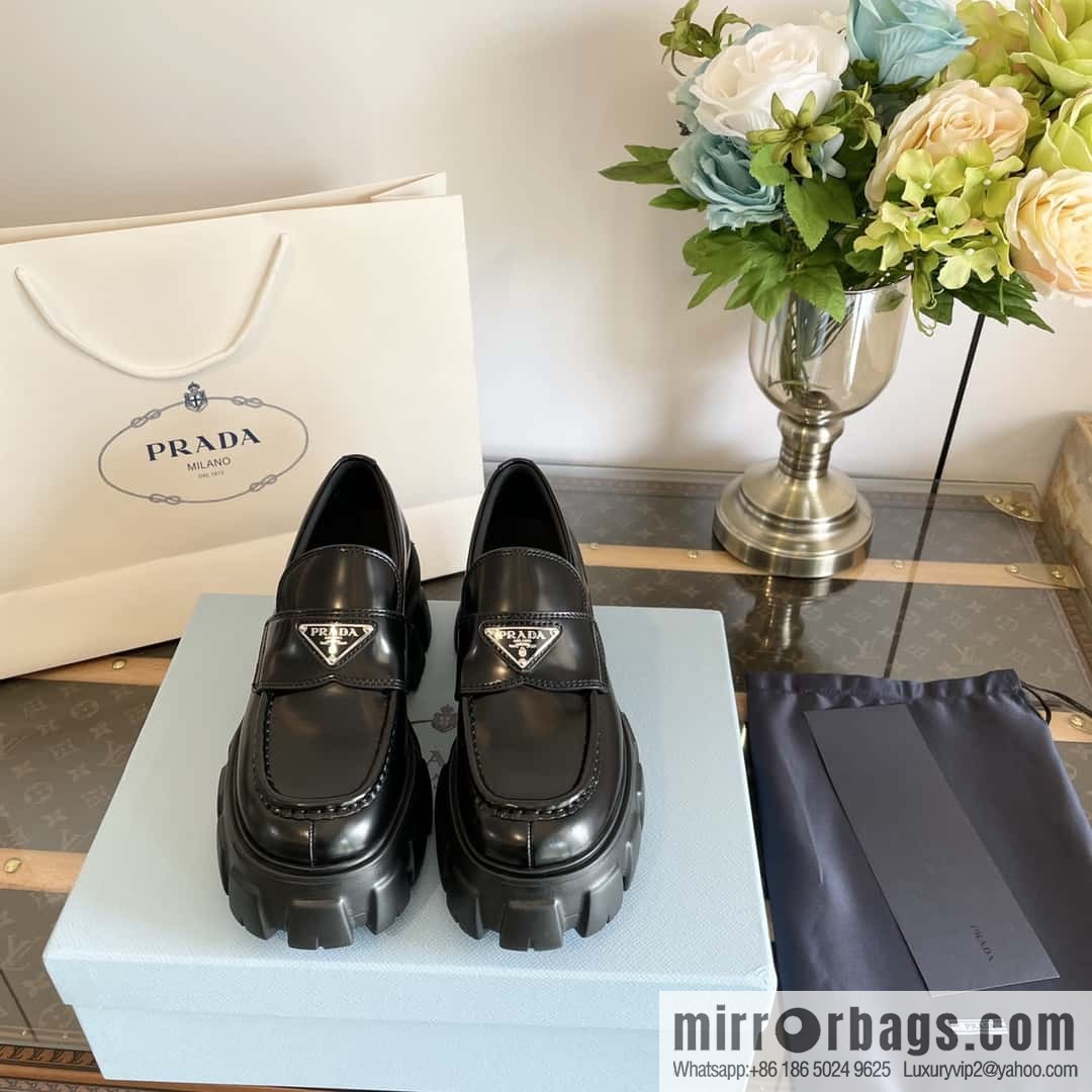 PRADA Prada, triangular label, serrated wheel muffin platform loafers 1D246M