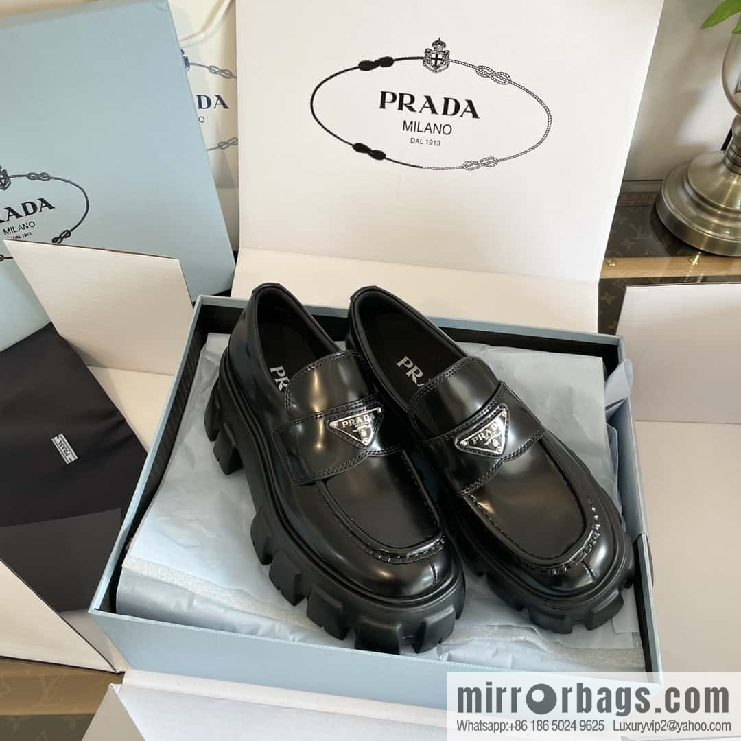 PRADA Prada, triangular label, serrated wheel muffin platform loafers 1D246M