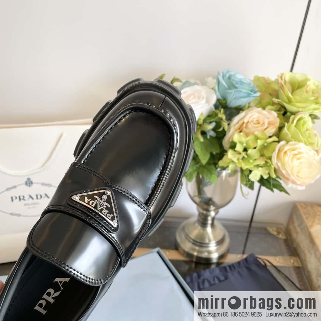 PRADA Prada, triangular label, serrated wheel muffin platform loafers 1D246M
