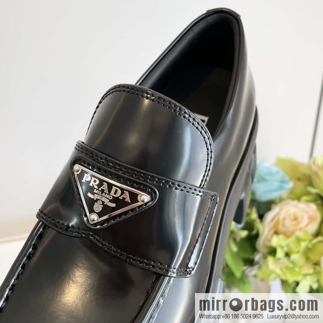 PRADA Prada, triangular label, serrated wheel muffin platform loafers 1D246M