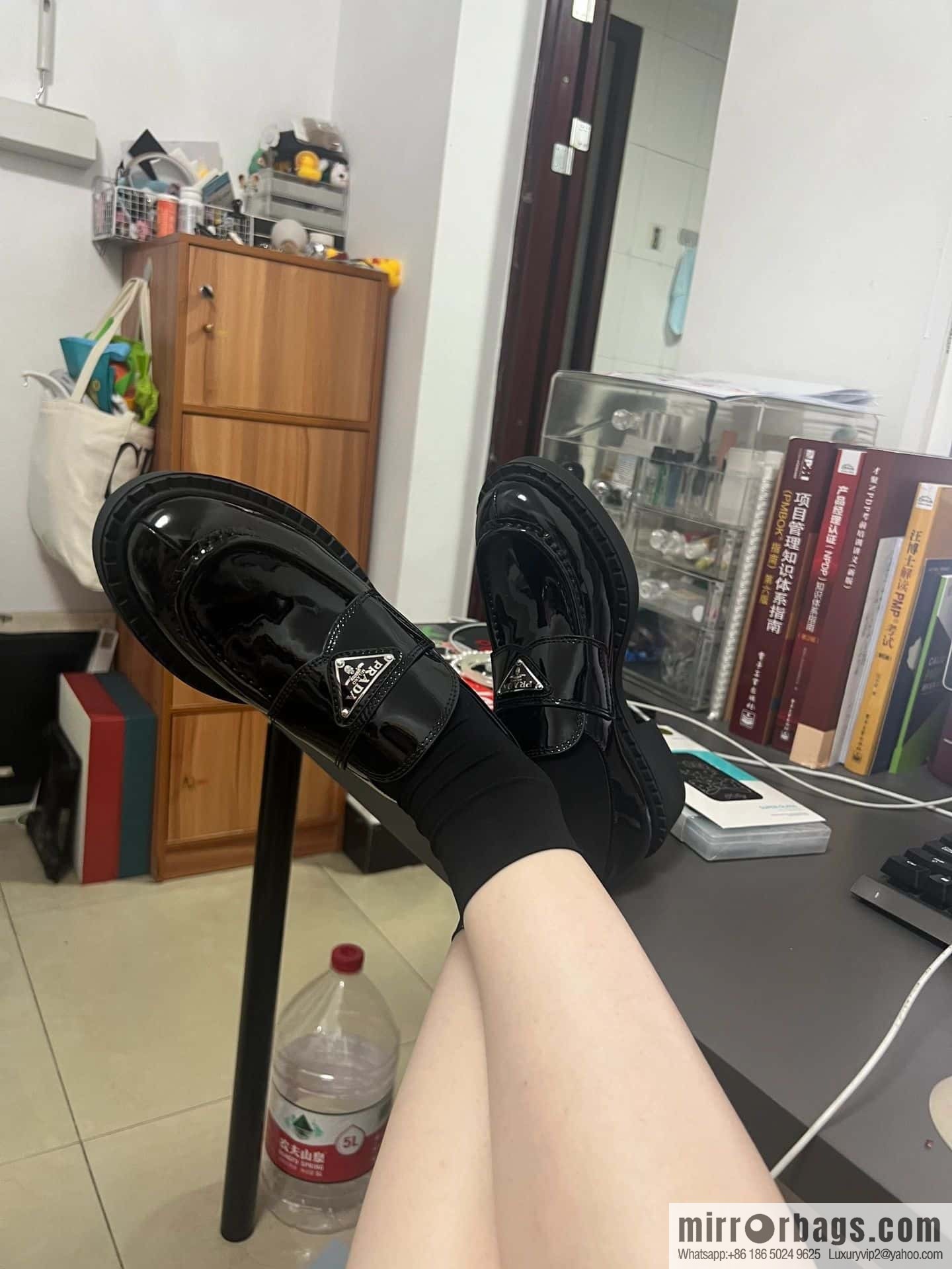 Prada, Puhada glossy patent leather triangle loafers