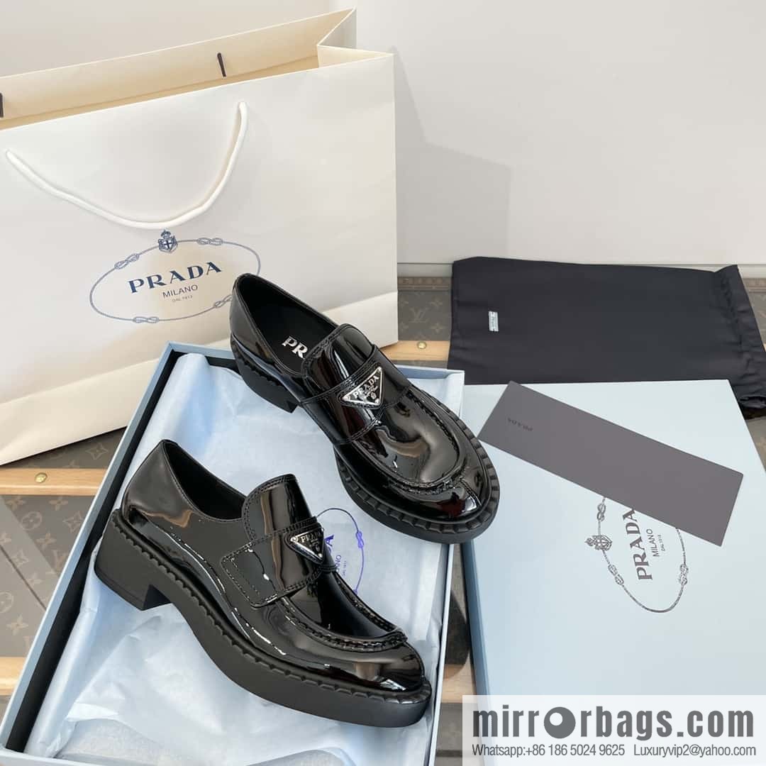 Prada, Puhada glossy patent leather triangle loafers