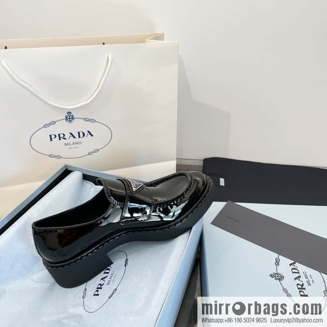 Prada, Puhada glossy patent leather triangle loafers
