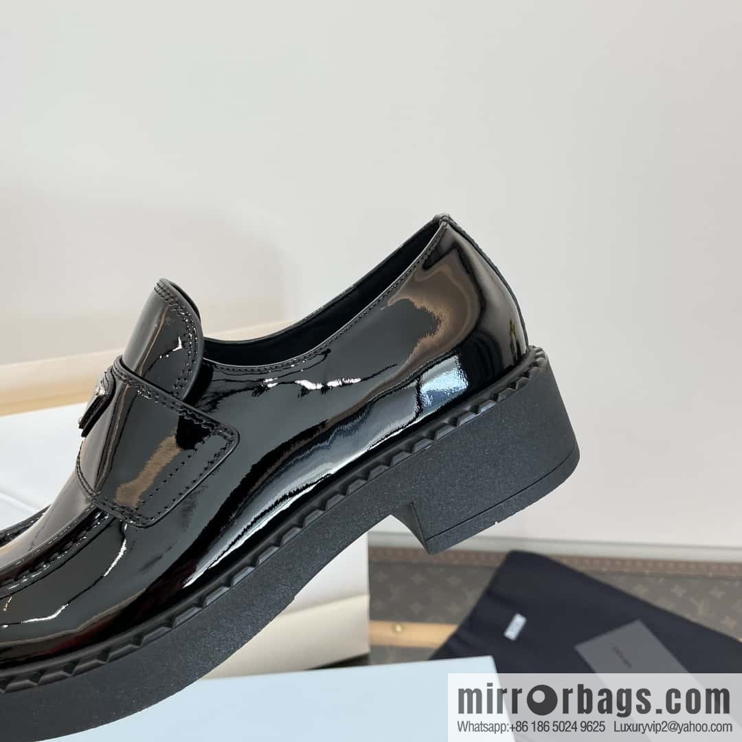 Prada, Puhada glossy patent leather triangle loafers