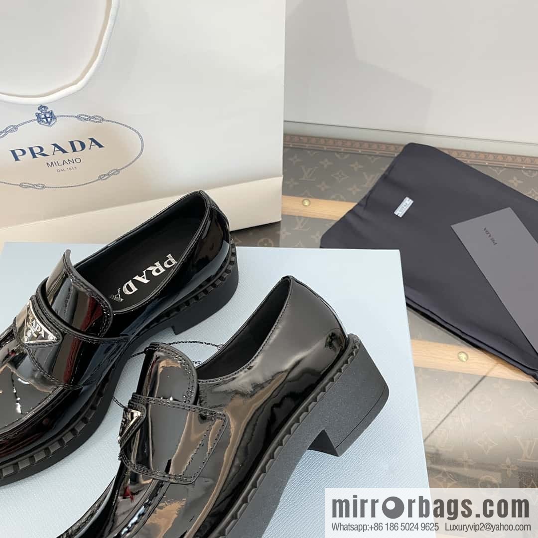 Prada, Puhada glossy patent leather triangle loafers