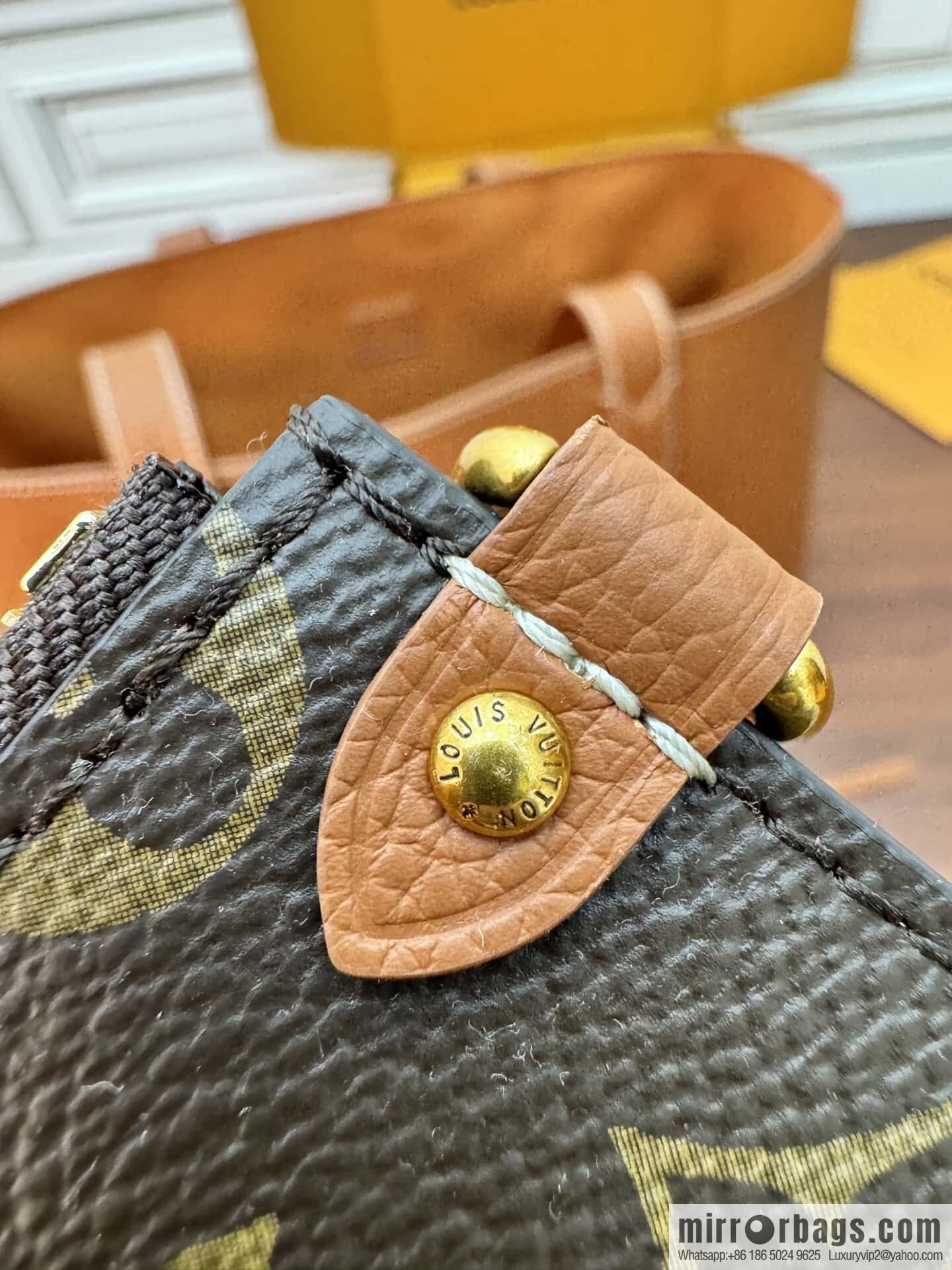 LV M25342 Low Key Cabas MM