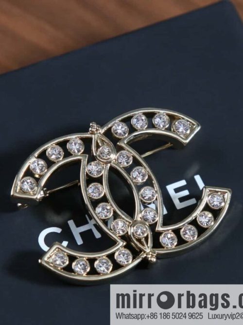 New, Chanel full diamond double c brooch.