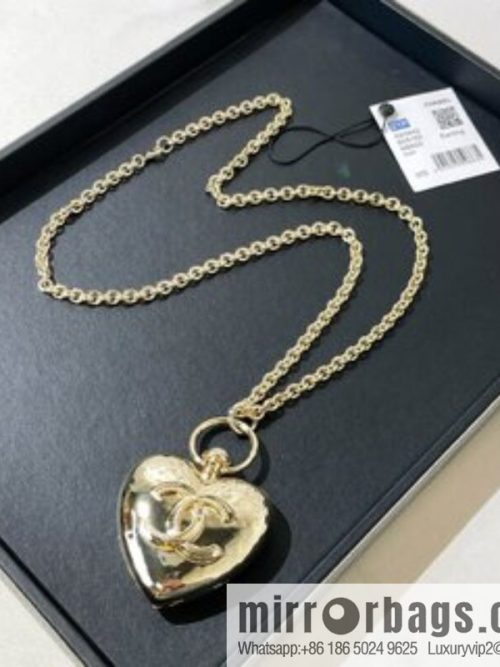 CHANEL Chanel double c gold peach heart sweater chain necklace
