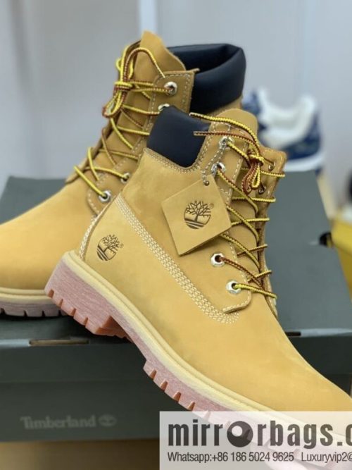 Timberland\'s beige frosted leather with white stitching and side stamping His & Hers boots