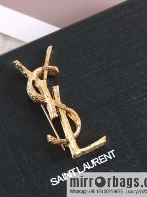 Saint Laurent gold YSL brooch
