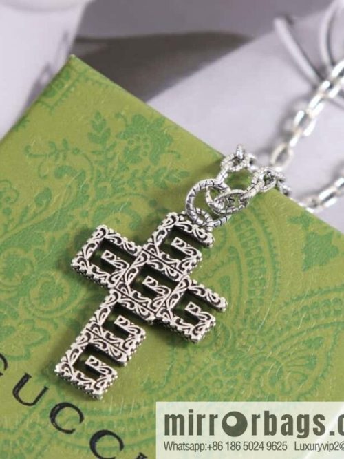 Gucci cross cut-out double G necklace