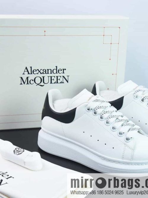 Alexander McQueen, black shiny low-top sneakers