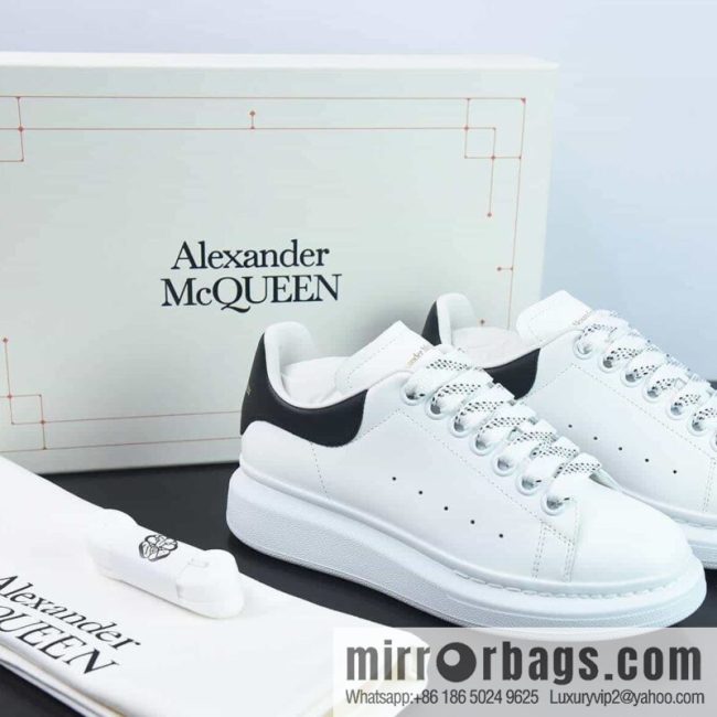 Alexander McQueen, black shiny low-top sneakers
