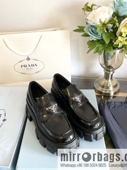 PRADA Prada, triangular label, serrated wheel muffin platform loafers 1D246M